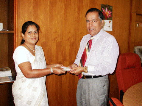 NGJA Chairman Presenting the 50th Stock of Silver to Mrs Rupika Perera