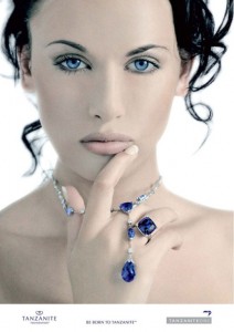A press release photo from the TanzaniteOne Mining Group.  A model wearing a tanzanite necklace pendant and ring
