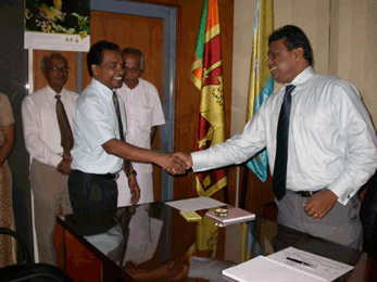 The Director General NGJA, Mr Mahindalal Gunatilake greeting the new Chairman.