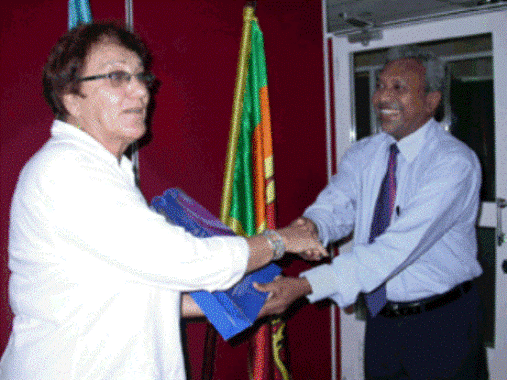 mrs-baker-presented-with-a-token-of-appreciation-by-the-acting-director-general-after-her-presentation