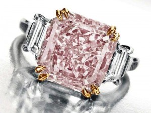Lot 131- Harry Winston Ring incorporating the 6.10-carat, fancy intense pink diamond