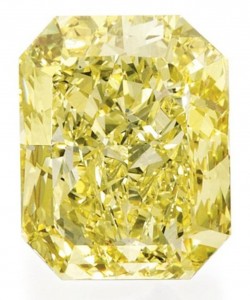 Lot 337 - An Impressive Platinum, 18k-Gold, Fancy Vivid Yellow Diamond And Diamond Ring