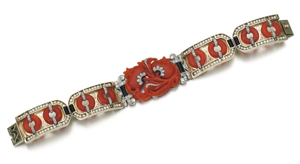 Lot 64 - Coral, Onyx, Seed Pearl and Diamond Bracelet, 1920s