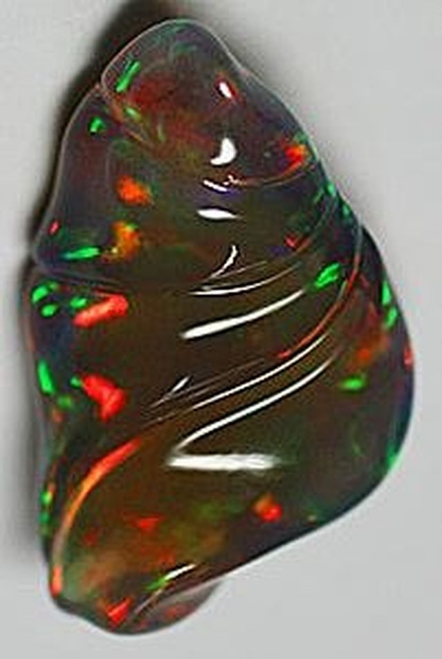 CARVING HONORABLE MENTION, LARRY WOODS, 17.60 CT. BLACK OPAL CARVING
