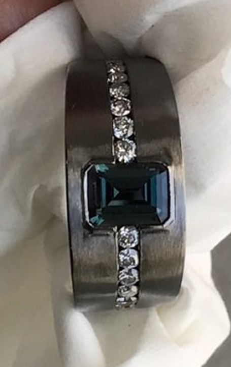 MEN'S WEAR MANUFACTURING HONORS, NIVEET NAGPAL, 18K WHITE GOLD WITH BLACK RHODIUM RING SET WITH 1.07 CT. EMERALD-CUT ALEXANDRITE ACCENTED WITH DIAMONDS AND ALEXANDRITES
