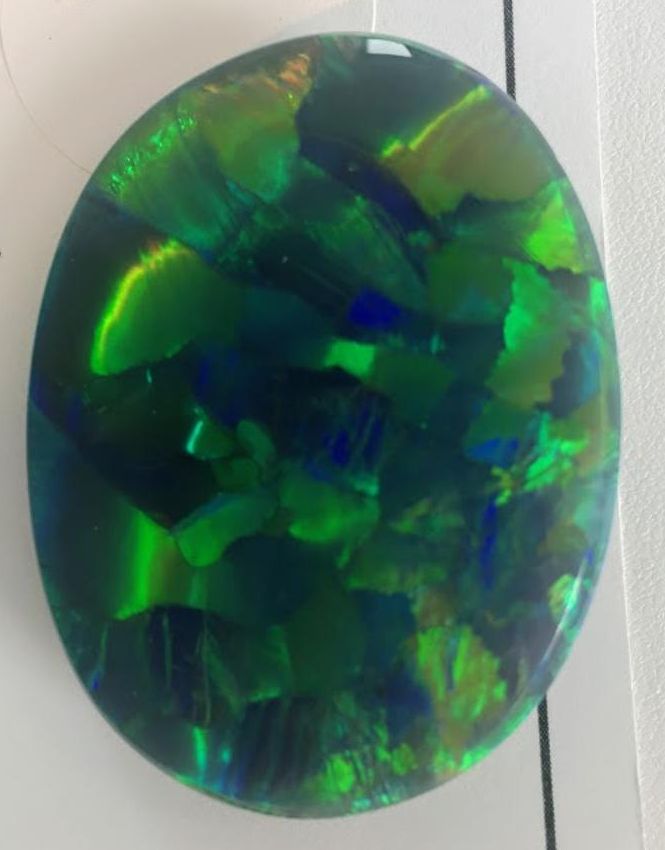 ANOTHER VIEW OF JOEL PRICE 100.66 CT. HARLEQUIN PATTERN BLACK OPAL
