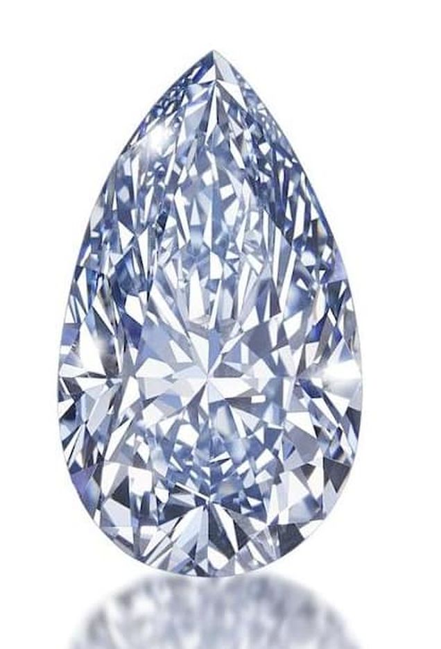 LOT 188 - 4.03-CARAT,FANCY INTENSE BLUE, PEAR-SHAPED DIAMOND AGAINST WHITE BACKGROUND