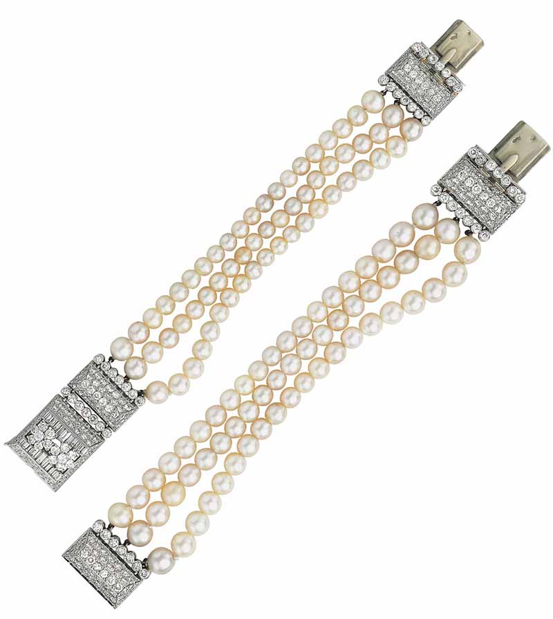 LOT 49 - A PAIR OF PEARL AND DIAMOND BRACELETS, BY 