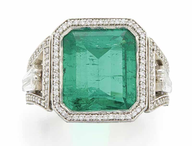 LOT 748 - EMERALD AND DIMOND RING 