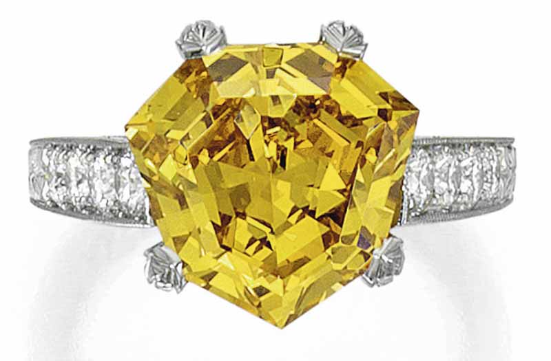 LOT 90 - FANCY VIVID YELLOW-ORANGE DIAMOND AND DIAMOND RING 