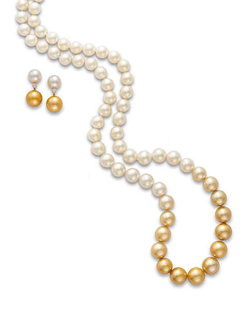 LOT 555 - A CULTURED PEARL AND DIAMOND NECKLACE AND EARRING SUITE