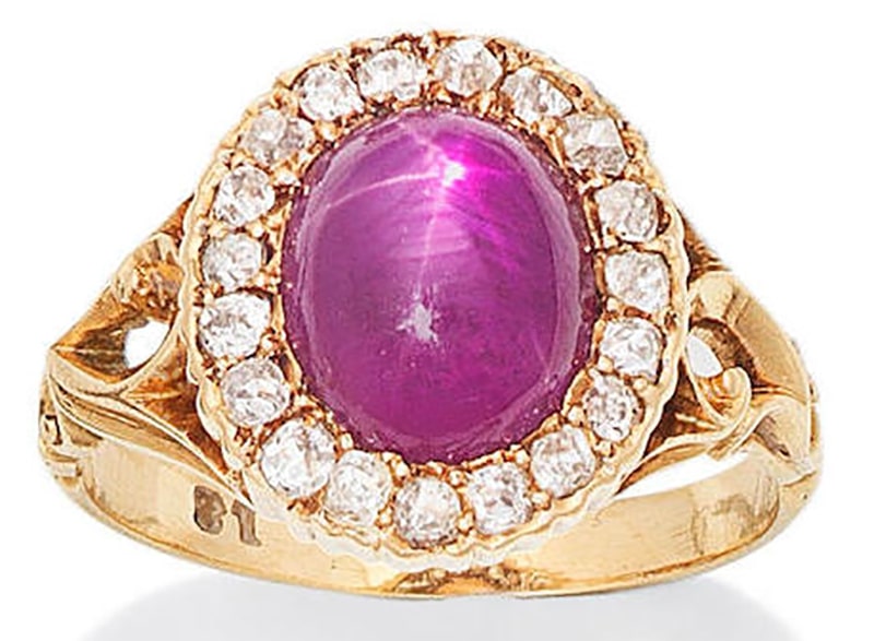 A PINK STAR SAPPHIRE AND DIAMOND CLUSTER RING